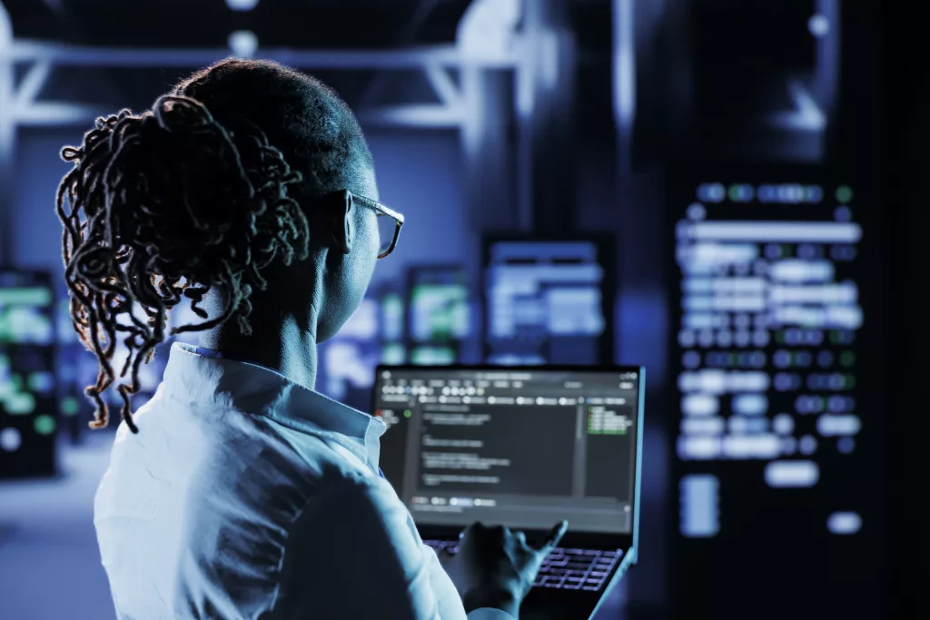 Technician coding in a data center